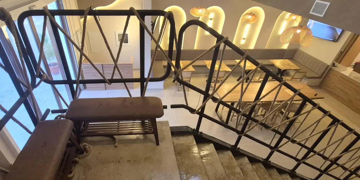 Staircase, lighting and interior details at Tsuna Academy